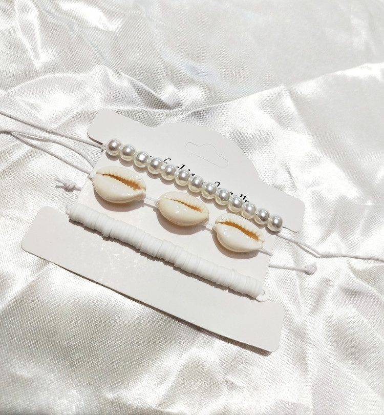 ست ۳ تایی دستبند و پابند مرواریدی و صدفی طبیعی (Cowrie) | قابل تنظیم، استایل ساحلی تابستانی دریایی، چندکاره از برند H&M ایتالیا