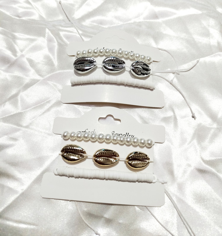 ست ۳ تایی دستبند و پابند مرواریدی و صدفی طبیعی طلایی و نقرهای (Cowrie) | قابل تنظیم، استایل ساحلی تابستانی دریایی، چندکاره از برند H&M ایتالیا
